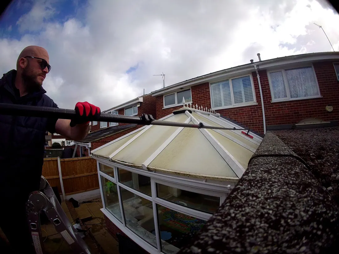 Dan cleaning a conservatory roof