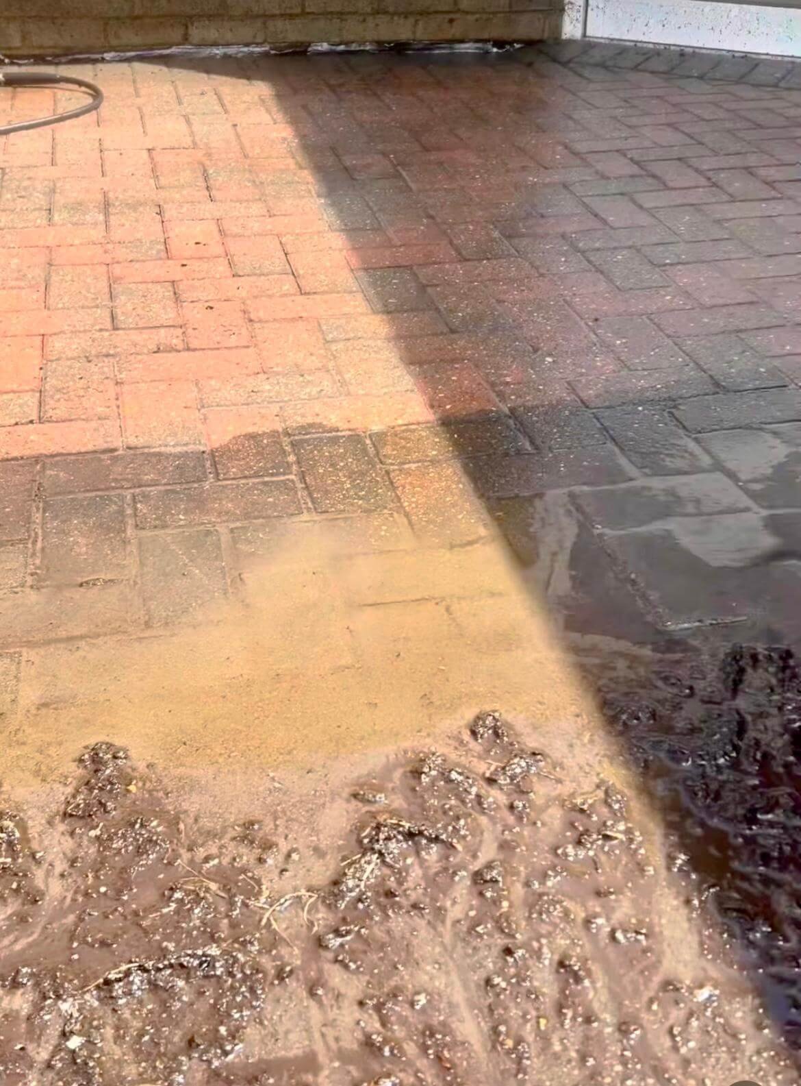 Driveway before and after pressure washing