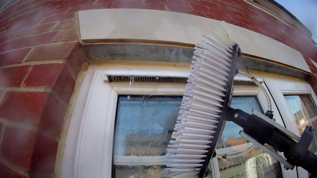 Water fed pole cleaning window vents during a first clean in Kelvedon